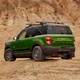 A photo of the rear end on a green Ford Bronco Sport.